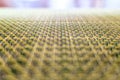 Close-up of beige fabric plastic lattice, grid texture pattern