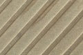 Close-up of beige-grey beton surface with diagonal stripes