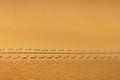 Close-up of beige orange faux leather stitching in the car interior. Background for interior trim comfort