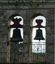 Close up of a bell tower with two bells of a stone church Royalty Free Stock Photo