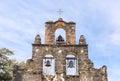 Close-up of The Bells of Mission Espada, San Antonio, Texas, with cross at peak Royalty Free Stock Photo