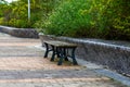 Close-up of benches on city sidewalk