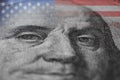 Close up Benjamin Franklin`s portrait of US dollar banknote. 100 dollar bills.American flag.