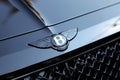 Close Up Of Bentley Winged B Logo On The Hood Of A Black Car