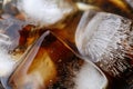 Close-up beverage cola and cubes ice refreshing cool in glass, black cola soda in glass with ice cubes for refreshments feel Royalty Free Stock Photo