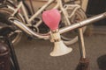 Close up of bicycle bell as a heart on handlebars Royalty Free Stock Photo