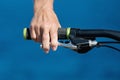 Close up bicycle rider's hands on a bicycle handlebar Royalty Free Stock Photo