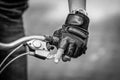 Close up bicycle rider`s hands on a bicycle handlebar. Royalty Free Stock Photo
