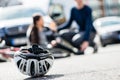 Close-up of a bicycling helmet fallen down on the ground after a