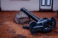 Close up of a big black anchor laying on the ground Royalty Free Stock Photo