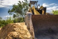 Close up of a big bucket of a yellow excavator Royalty Free Stock Photo