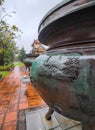 Close-up of a big decorated metal pot at Mausoleum of Emperor Tu Duc, Hue, Vietnam
