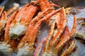 Close up of big giant King crab legs on ice selling at market Royalty Free Stock Photo