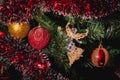 Close up big gold and red glitter ball and glass angel christmas on tree Royalty Free Stock Photo