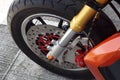 close up of big motorcycle front wheel, focus disc brake Royalty Free Stock Photo