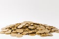 Close up of big pile of golden coins isolated on white background. Concept of money business growth gain success Royalty Free Stock Photo