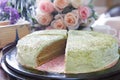 Close up big pound of green tea cake sliced on table top Royalty Free Stock Photo