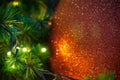 Close up big red glitter ball christmas on tree with wire white light background