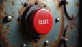 Close up of a big red reset button on a rusty metallic industrial panel. Emergency switch needs to restart old machinery. Royalty Free Stock Photo