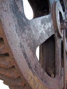 Close up of a big steel rusted cog wheel with large gear teeth