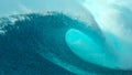 CLOSE UP: Big tube wave crashes on the sunny coast of a remote tropical island. Royalty Free Stock Photo