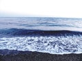 Close-up of big waves breaking on the coast in Liguria, Italy, Europe.