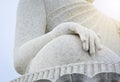 Close up of big white marble Buddha statue hand with cloudy sky background, Thailand Royalty Free Stock Photo