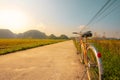 Close up of bike next to field in the beautiful countryside of Vietnam