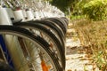 Close-up of bike wheels, public bike rental facilities on the street