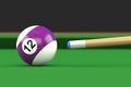 Close-up of billiard ball number twelve in purple and white color on billiard table