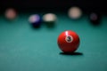 Close-up billiard red ball number 3. Colorful billiard balls on the green table. snooker and pool Royalty Free Stock Photo