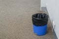 Bin with trash plastic bag on office floor Royalty Free Stock Photo