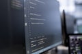 Close up of binary script running on PC monitors
