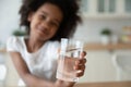 Close up of biracial child recommend water drinking Royalty Free Stock Photo