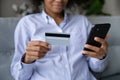 Close up of biracial woman make payment on smartphone Royalty Free Stock Photo