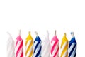 Close up of birthday candles on white