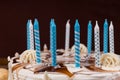 Close up of birthday candles on white homemade cake