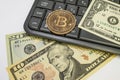 Bitcoin coin with US dollars and computer keyboard Royalty Free Stock Photo