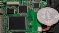 Close-up of bitcoin, computer circuit board with bitcoin processor and microchips. Electronic currency, internet finance rypto cur