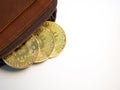 Close up bitcoin gold coins with wallet on the white background. Virtual cryptocurrency concept. Royalty Free Stock Photo