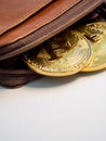 Close up bitcoin gold coins with wallet on the white background. Virtual cryptocurrency concept Royalty Free Stock Photo