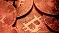 Close-up of bitcoins rotating under copper light. Online payment, symbol of BTC. Market trading profit, mining