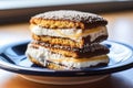 close-up of a bitten vanilla ice cream sandwich on a ceramic plate Royalty Free Stock Photo