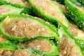 Close up bitter gourd pile with stuffed hack pork and garlic black pepper ingredient. vegetable herb Nourish the health body Royalty Free Stock Photo
