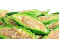 Close up bitter gourd pile with stuffed hack pork and garlic black pepper ingredient. vegetable herb Nourish the health body Royalty Free Stock Photo