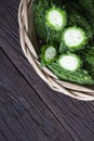 Close up Bitter melon bitter gourd cucumber or Momordica charantia in wooden bowl isolated on old wood table Royalty Free Stock Photo