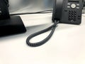 Close-up of a black business landline telephone with copy space