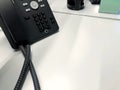 Close-up of a black business landline telephone with copy space