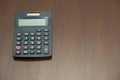 Close-up of black Calculator on wooden table Royalty Free Stock Photo