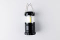 Close up of black camping lamp on white background with copy space